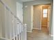 Bright entryway with tile floors and white staircase at 7215 Stockton Dunes St, North Las Vegas, NV 89084