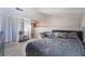 Cozy bedroom with gray bedding and a loft-style layout at 4770 Topaz St # 88, Las Vegas, NV 89121