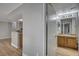 Bathroom with wood vanity, sink, and a shower stall at 8600 W Charleston Blvd # 1092, Las Vegas, NV 89117