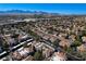 Aerial view of community, showcasing numerous homes and mountain backdrop at 8600 W Charleston Blvd # 1092, Las Vegas, NV 89117