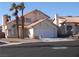 Two-story house with tile roof, attached garage, and desert landscaping at 3275 Canyon Terrace Dr, Laughlin, NV 89029