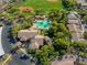 Aerial view of community pool, clubhouse, and surrounding homes at 10528 Meadow Mist Ave, Las Vegas, NV 89135