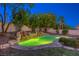 Inviting pool and waterfall feature, surrounded by lush landscaping at 10528 Meadow Mist Ave, Las Vegas, NV 89135