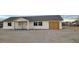 Newly built single-story home with a gray roof and attached garage at 220 N David St, Pahrump, NV 89060