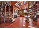 Grand library with fireplace, spiral staircase, and built-in bookshelves at 9409 Kings Gate Ct, Las Vegas, NV 89145