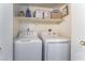 Laundry closet with washer, dryer, and shelving at 2725 S Nellis Blvd # 1075, Las Vegas, NV 89121