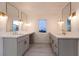 Elegant bathroom with dual vanities and quartz countertops at 2105 Westlund Dr, Las Vegas, NV 89102