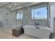 Modern bathroom featuring a large soaking tub and glass shower at 40 Reflection Shores Ln, Henderson, NV 89011