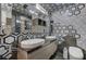 Chic bathroom with hexagon-tiled walls and double vanity at 2945 S Monte Cristo Way, Las Vegas, NV 89117