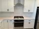 Modern kitchen with white cabinets, stainless steel appliances, and quartz countertops at 2252 Bird Of Prey St, Las Vegas, NV 89138