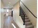 Bright and airy entryway with staircase and kitchen view at 2252 Bird Of Prey St, Las Vegas, NV 89138