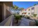 Complex exterior with lush landscaping and walkway at 3791 Desert Marina Dr # 109, Laughlin, NV 89029