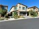 Two-story house with attached garage and landscaping at 5351 Peacock Lily St, Las Vegas, NV 89113