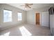 Bright bedroom with carpet, ceiling fan, and attached bath at 344 Hedgehope Dr, Las Vegas, NV 89183