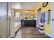 Elegant bathroom with double sinks, a soaking tub, and yellow walls at 10950 Cherokee Landing St, Las Vegas, NV 89179