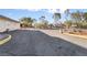 Large asphalt parking lot with surrounding desert landscaping at 241 Palo Verde Dr, Henderson, NV 89015