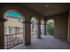 Private balcony with arched entryway and wrought iron railings at 207 Crooked Putter Dr, Las Vegas, NV 89148