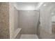 Spa-like shower with granite walls and a built-in seat at 207 Crooked Putter Dr, Las Vegas, NV 89148