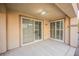 Covered patio with sliding glass doors leading to the interior at 207 Crooked Putter Dr, Las Vegas, NV 89148