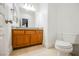 Bathroom with wood cabinets and granite countertop at 207 Crooked Putter Dr, Las Vegas, NV 89148