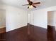 Bright bedroom with dark hardwood floors, ceiling fan, and ample closet space at 3760 S Torrey Pines Dr, Las Vegas, NV 89103