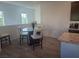 Breakfast nook with a glass-top table and four chairs at 7334 N Decatur Blvd # 6, North Las Vegas, NV 89084