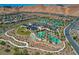 Aerial view of community with pools, tennis courts, and homes at 41 Sun Mirage Ave, Henderson, NV 89011