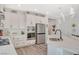 Modern kitchen with white cabinets, stainless steel appliances, and quartz countertops at 41 Sun Mirage Ave, Henderson, NV 89011