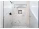 Shower with marble tile and a window for ventilation at 2222 Little River Ct, Las Vegas, NV 89156