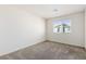 Simple bedroom with neutral wall paint and carpet at 6816 Alpine White Ct, North Las Vegas, NV 89086