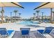 Resort-style pool with ample seating and shade at 6816 Alpine White Ct, North Las Vegas, NV 89086