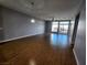 Spacious living room with hardwood floors and large windows at 8925 W Flamingo Rd # 322, Las Vegas, NV 89147