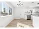 Modern kitchen with white shaker cabinets and stainless steel appliances at 528 Kings Ave, North Las Vegas, NV 89030