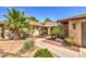 Landscaped front yard with mature palm trees and walkway at 2880 Red Rock St, Las Vegas, NV 89146