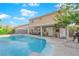 Large pool with patio and house in background at 2098 Merano Ct, Las Vegas, NV 89123