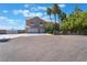 Two-story house with a three-car garage and palm trees at 8535 Belcastro St, Las Vegas, NV 89113