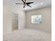 Bright bedroom with ceiling fan, window, and access to en-suite bathroom at 85 Alerion St, Las Vegas, NV 89138