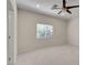 Spacious bedroom with ceiling fan, large window, and plush carpeting at 85 Alerion St, Las Vegas, NV 89138