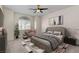 Virtually staged main bedroom with plush carpet and large windows at 85 Alerion St, Las Vegas, NV 89138