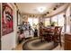 Charming kitchen area with a dining table, antique stove, and rustic decor at 8600 Lynhurst Dr, Las Vegas, NV 89134