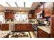 Kitchen featuring granite countertops, stainless steel appliances, and ample wood cabinetry at 8600 Lynhurst Dr, Las Vegas, NV 89134