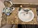 Overhead view of a bathroom sink with granite countertop, and decorative accents at 130 Spring Mountain Vista Ave, Pahrump, NV 89060