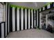 Bedroom with black and white striped walls, and a closet at 7221 Walnut Ridge Cir, Las Vegas, NV 89119