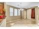 Light and airy dining area with tile floors and entryway view at 11420 Ogden Mills Dr # 101, Las Vegas, NV 89135