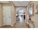 Inviting entryway with tile flooring, glass-top console table, and view into the living area at 3741 Garnet Heights Ave, North Las Vegas, NV 89081