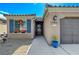 Inviting front entry with decorative planters and blue shutters at 3741 Garnet Heights Ave, North Las Vegas, NV 89081