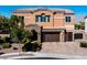 Two-story house with stone accents and landscaping at 7380 Abundant Harvest Ave, Las Vegas, NV 89131