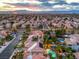 Aerial view of house, pool, and surrounding neighborhood at 1240 Fragrant Spruce Ave, Las Vegas, NV 89123