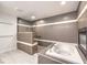 Spa-like bathroom with soaking tub and walk-in shower at 1240 Fragrant Spruce Ave, Las Vegas, NV 89123