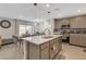 Modern kitchen with island and stainless steel appliances at 329 Brockbank Pl, Henderson, NV 89011